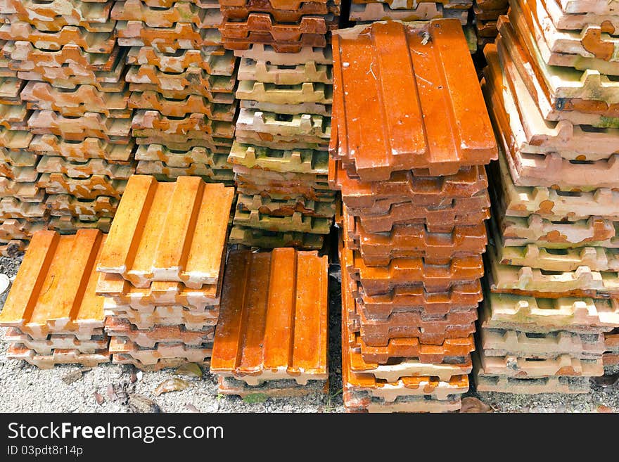 Close up of a stack of ceramic roof tiles. Close up of a stack of ceramic roof tiles.