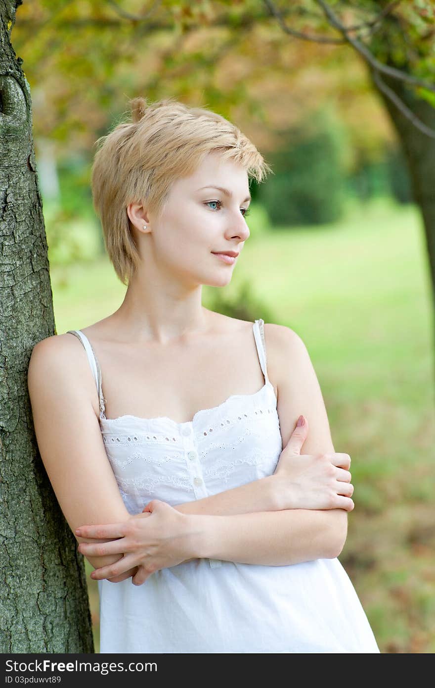 Outdoors portrait of happy young woman