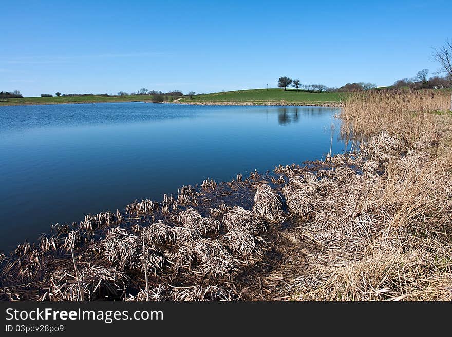 Beautiful blue water lake landscape in the summer. Beautiful blue water lake landscape in the summer