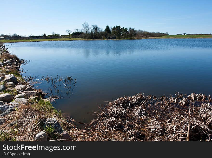 Beautiful blue water lake landscape in the summer. Beautiful blue water lake landscape in the summer