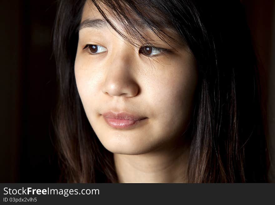 A close up of a young Asian woman.