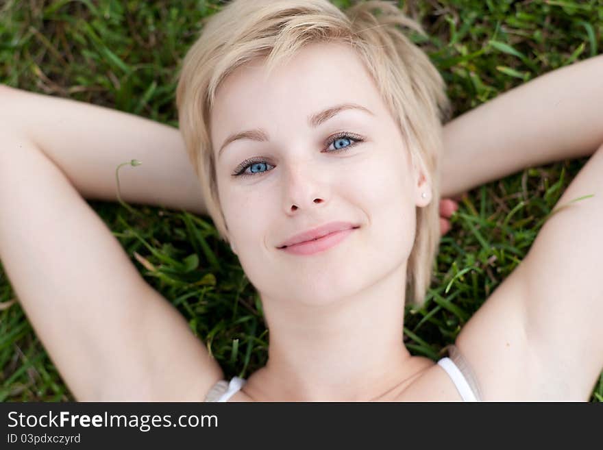 Closeup portrait of beautiful smiling woman outdoo