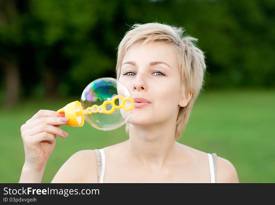 Young Woman Start Soap Bubbles