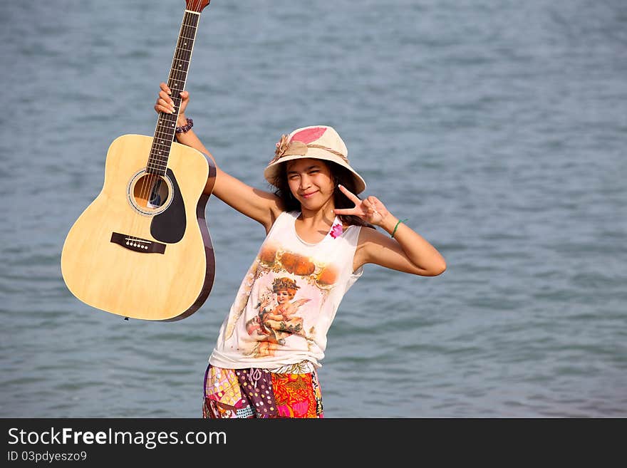 Pretty young woman with guitar