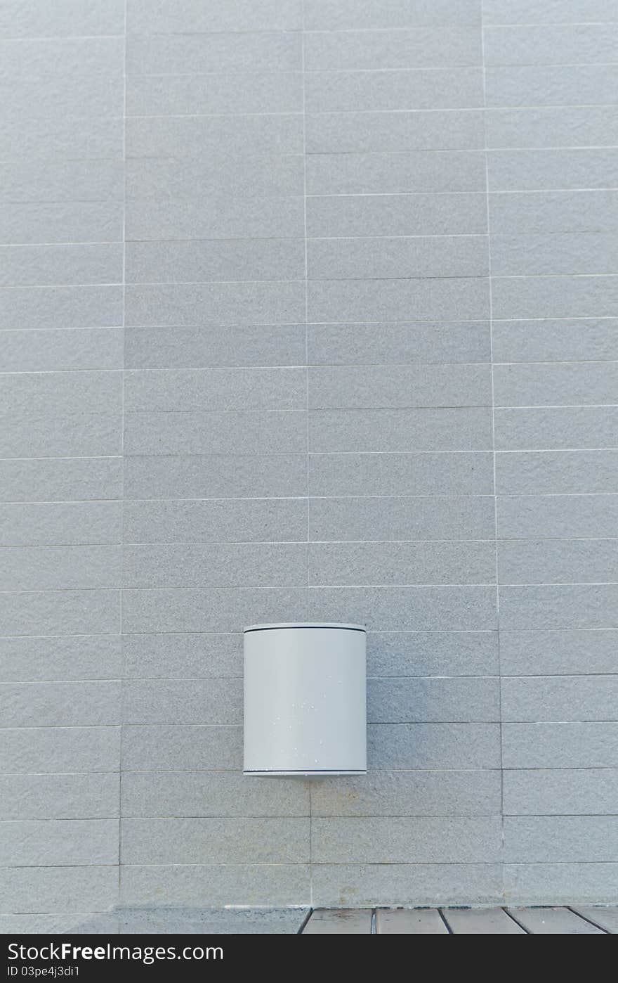 Electric lamp with gray stone wall background