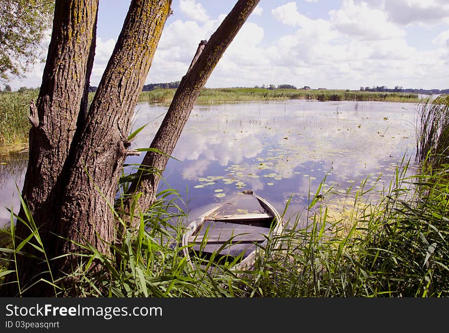 Lake landscape with old boat