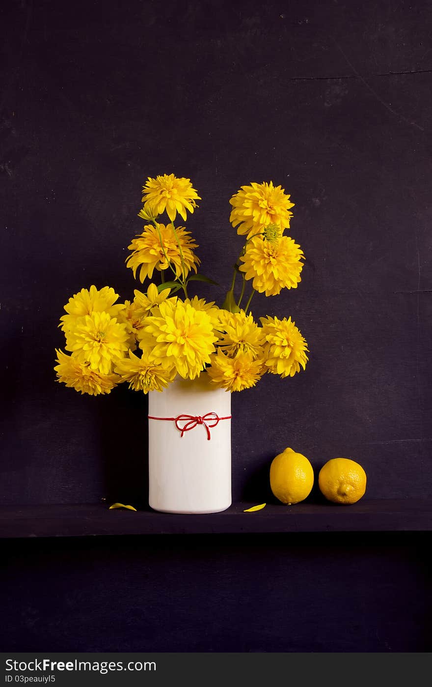 Still-life with yellow dahlia and lemons