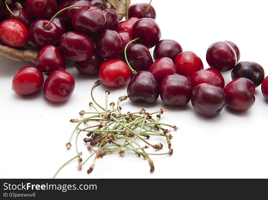 Red cherries with stem onto white background