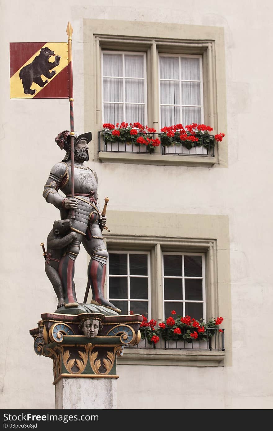 The statue of warrior with the flag of bear, the symbol of Bern in Switzerland. The statue of warrior with the flag of bear, the symbol of Bern in Switzerland.