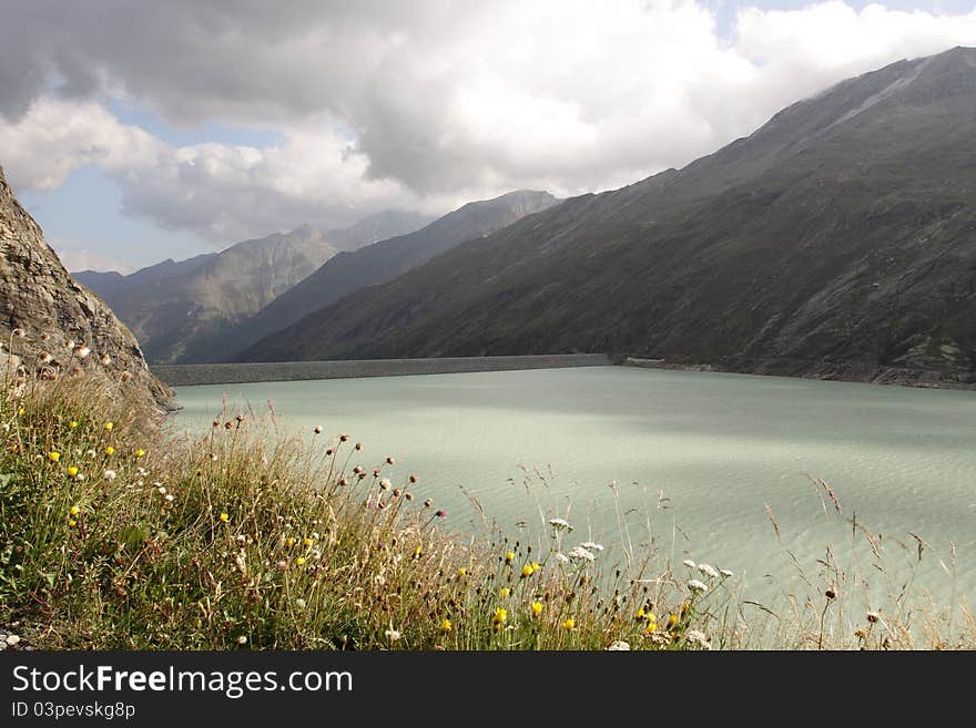 The water reservoir Mattmark dam in the Saas Valley, Switzerland.