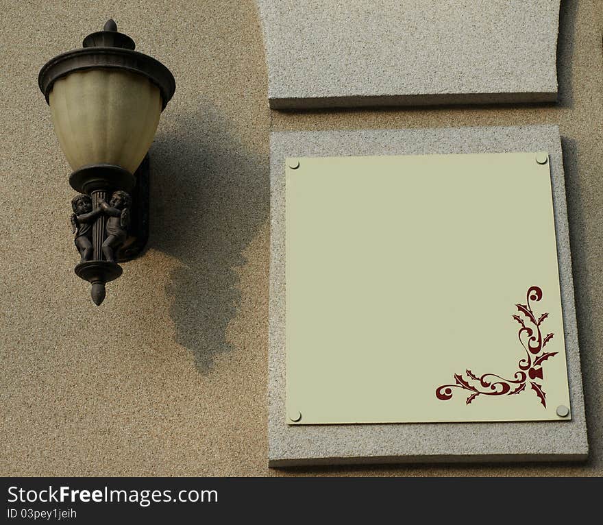 Wall of the house with a sign