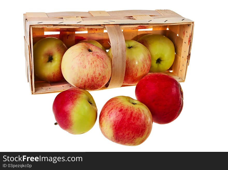 Fresh green, red apples in wooden basket isolated over white background. Fresh green, red apples in wooden basket isolated over white background.