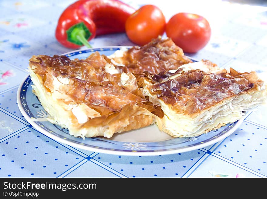 Domestic pie with cheese on plate