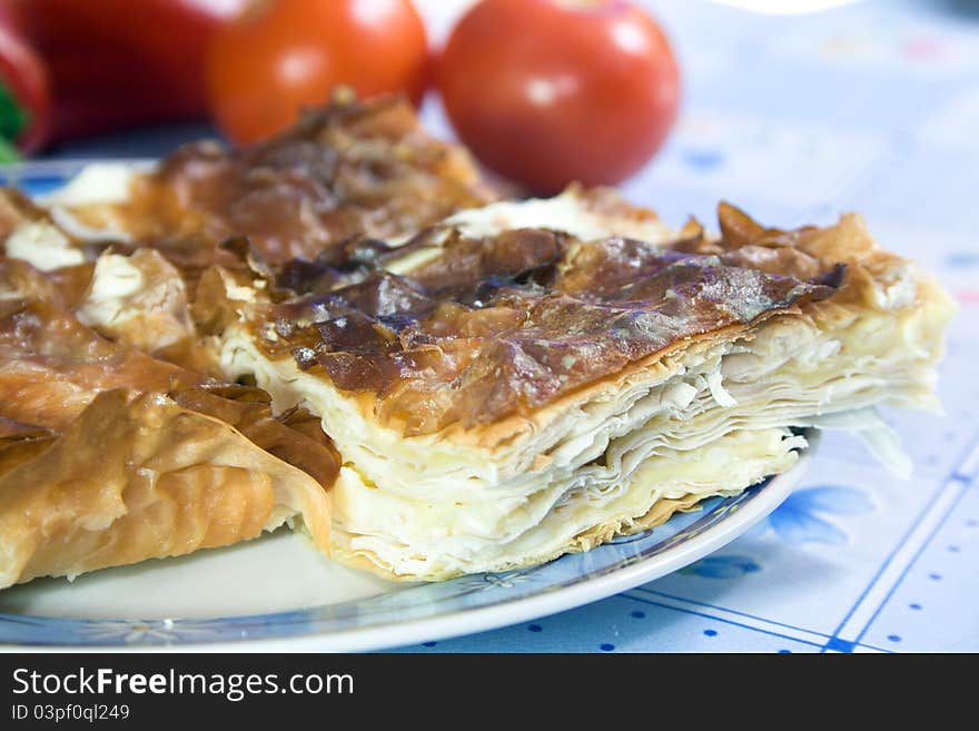 Domestic pie with cheese on plate