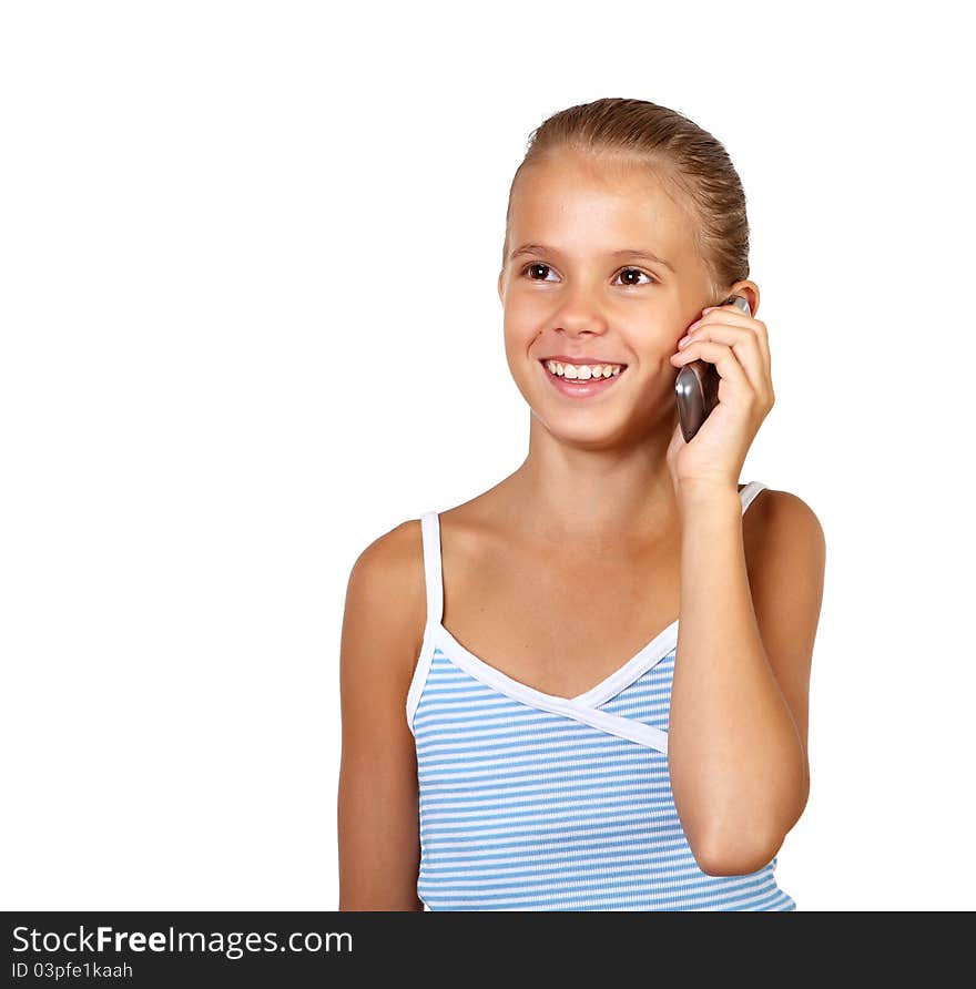 Pretty teenage girl with mobile phone in studio