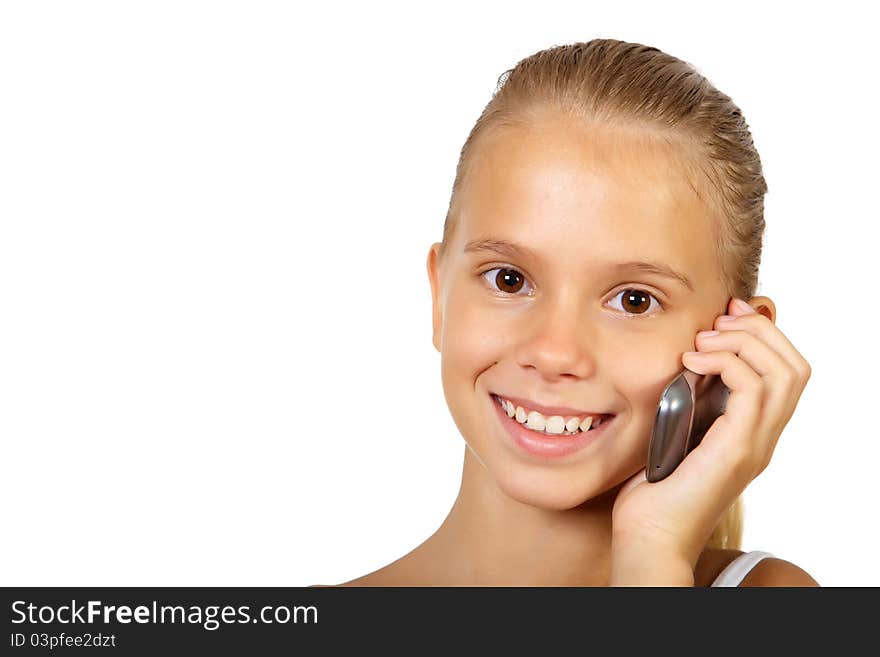 Pretty teenage girl with mobile phone in studio