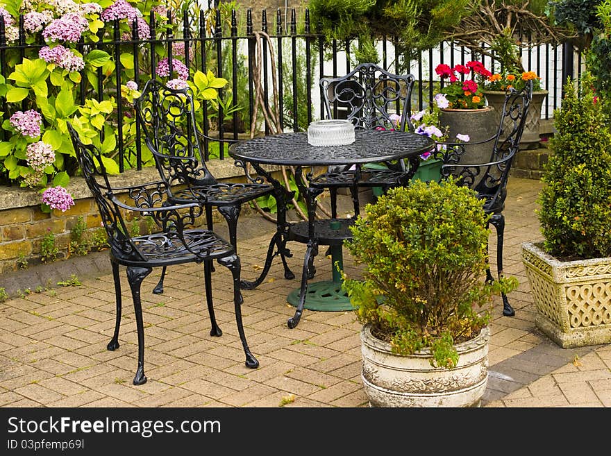 Set of black table and chairs placed outside