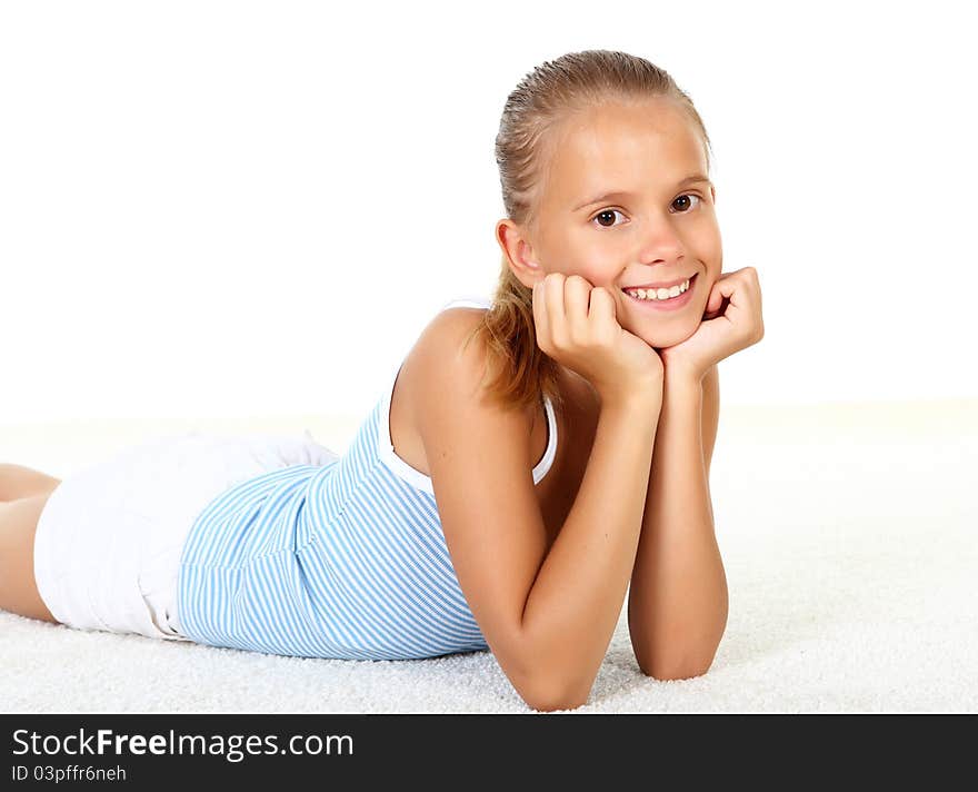 Portrait of pretty teenage girl in studio against white background