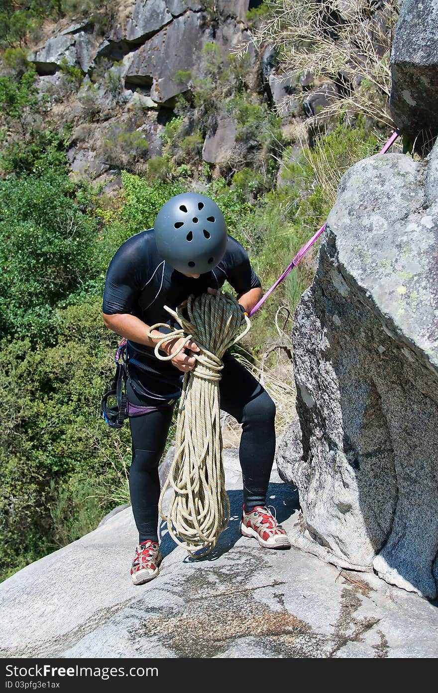 Men prepering to rappeling on waterfall. Men prepering to rappeling on waterfall