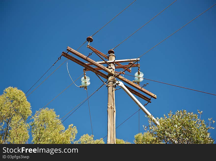 Electricity pole and line shot from the ground up. Electricity pole and line shot from the ground up