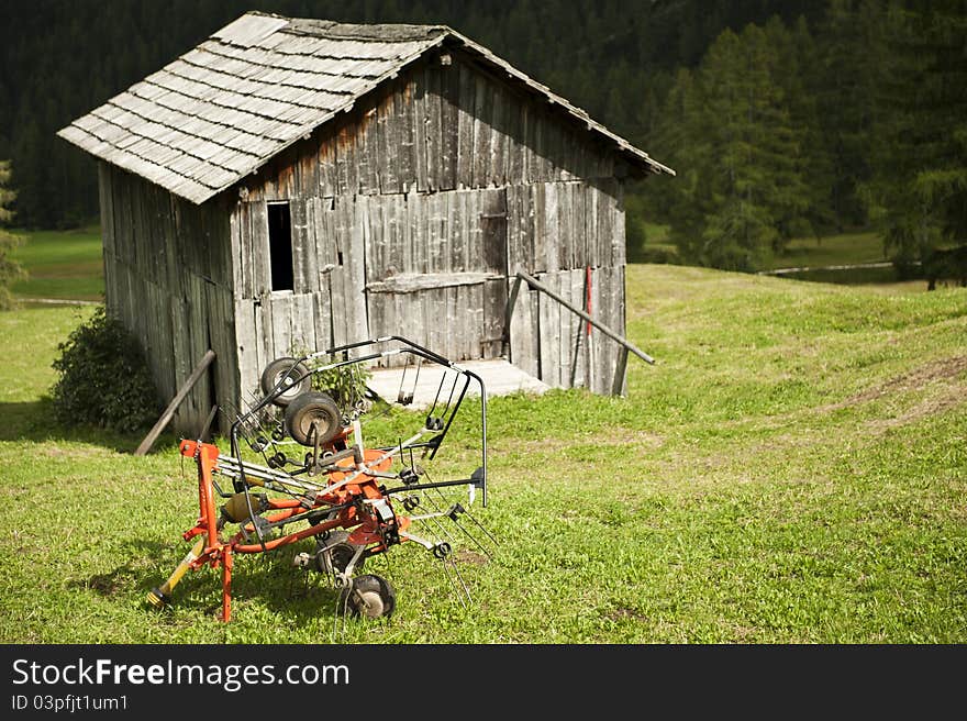 Agricultural implement and hut