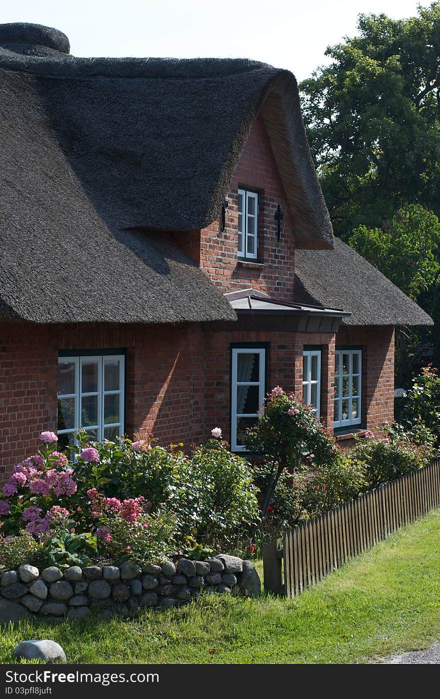 Historic building with thatched roof on the island of Amrum, Germany