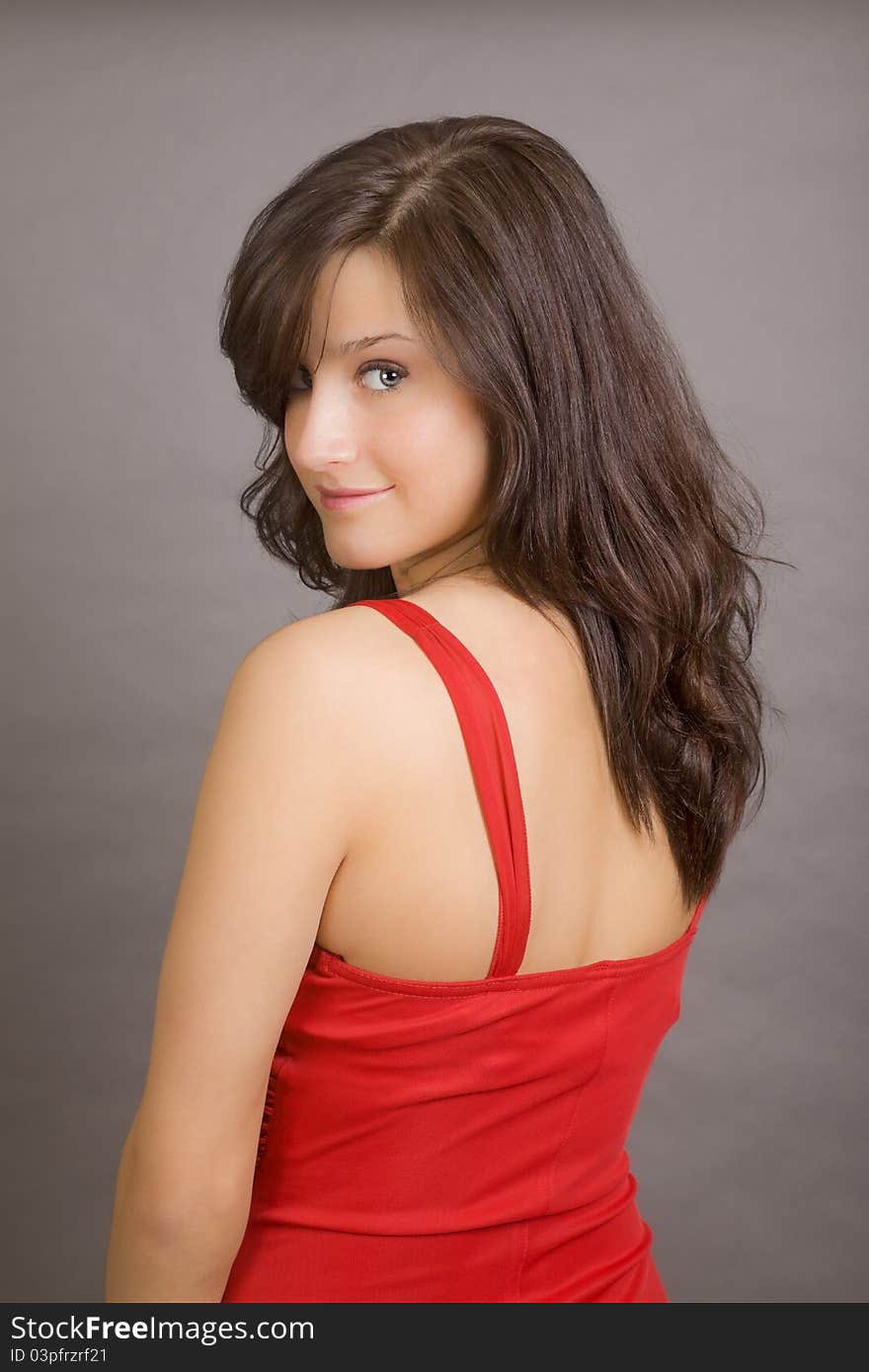 A very attractive woman wearing a red evening gown. A very attractive woman wearing a red evening gown