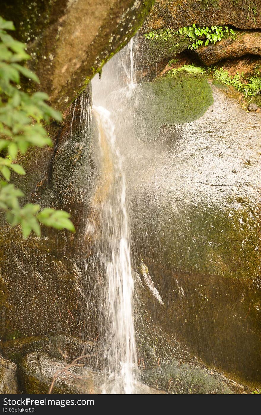 A Waterfall Breaking Through Stones