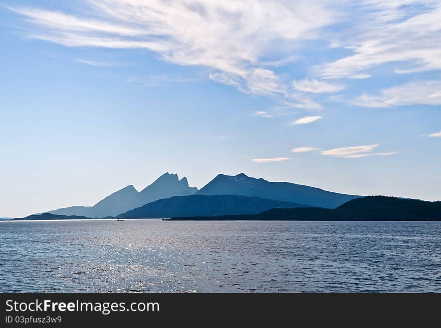 Sea, mountains and clouds on the horizon