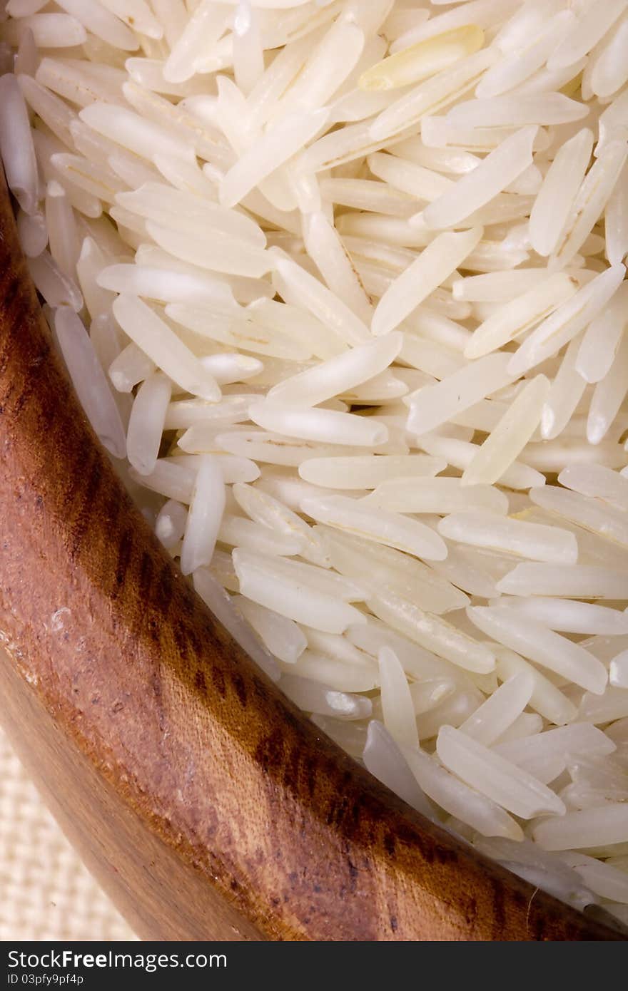 Close-up of white rice in a brown plate.