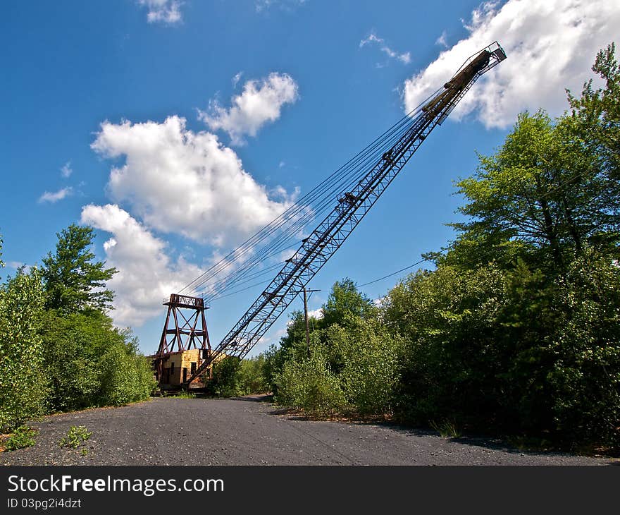 Frontal view of an abandoned derelict mining crane used for surface coal strip mining. Frontal view of an abandoned derelict mining crane used for surface coal strip mining.