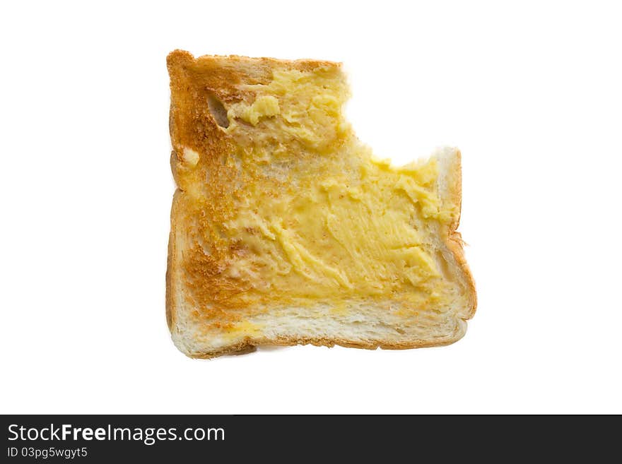 Butter the bread eaten on white background