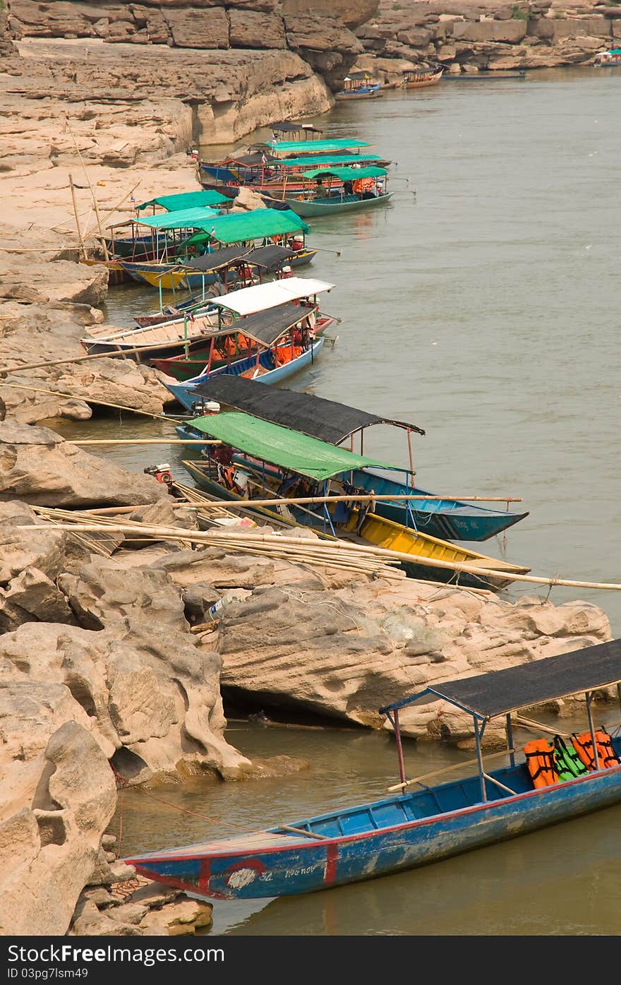 Touring boat to see eroded stone Sampanbok at Mekong river Ubonratchathani province Thailand