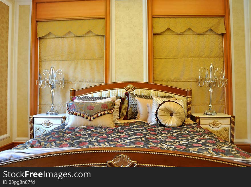 Luxury and noble style bedroom internal, with featured wall paper and decoration, shown as luxury, classical, and comfortable living environment. Luxury and noble style bedroom internal, with featured wall paper and decoration, shown as luxury, classical, and comfortable living environment.