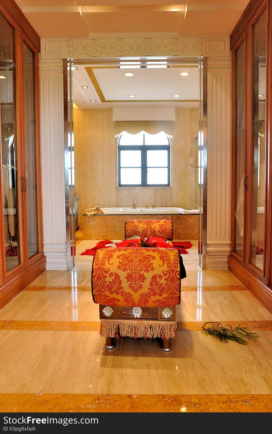 Dressing and bathroom in luxury decorating style, with depth view and functional space.