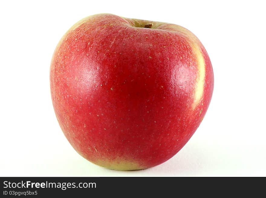 Single organic apple isolated on a white background. Single organic apple isolated on a white background