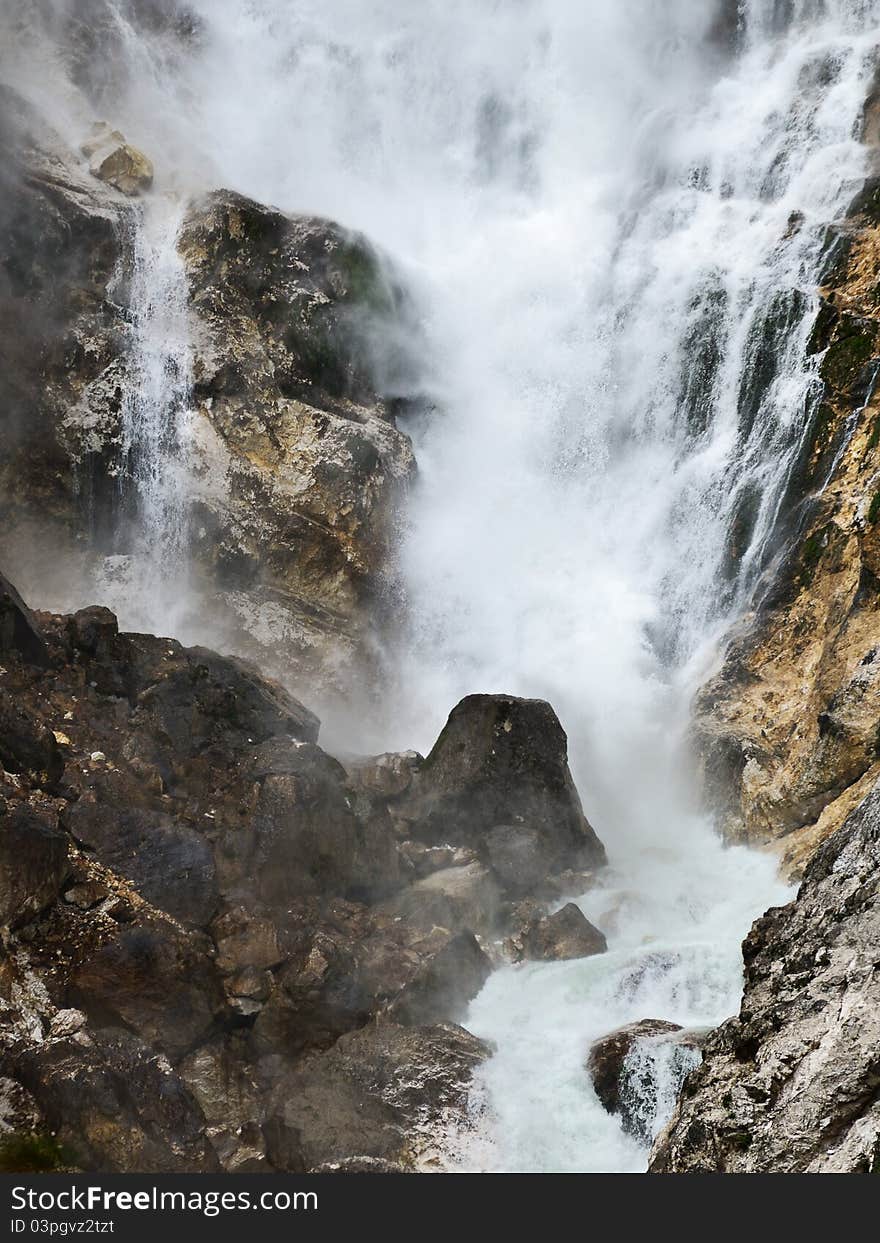 Big powerful waterfall in the mountains. Big powerful waterfall in the mountains