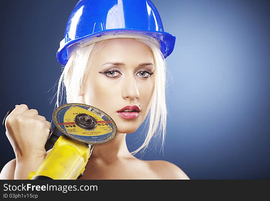 Portrait Of A Beautiful Model With Angle Grinder