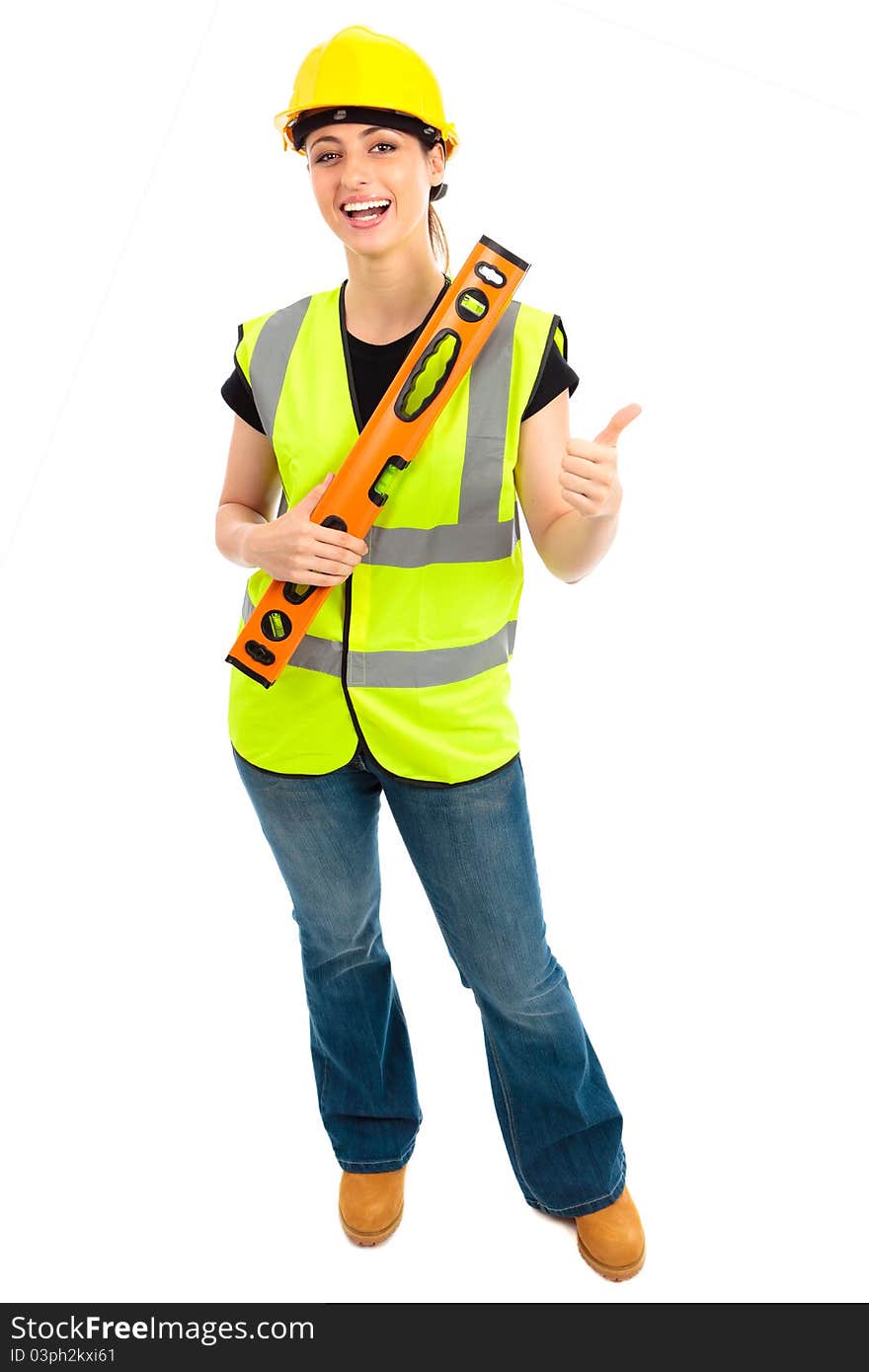 A females dressed in a high visibility jacket holding a spirit level on isloated white background. A females dressed in a high visibility jacket holding a spirit level on isloated white background