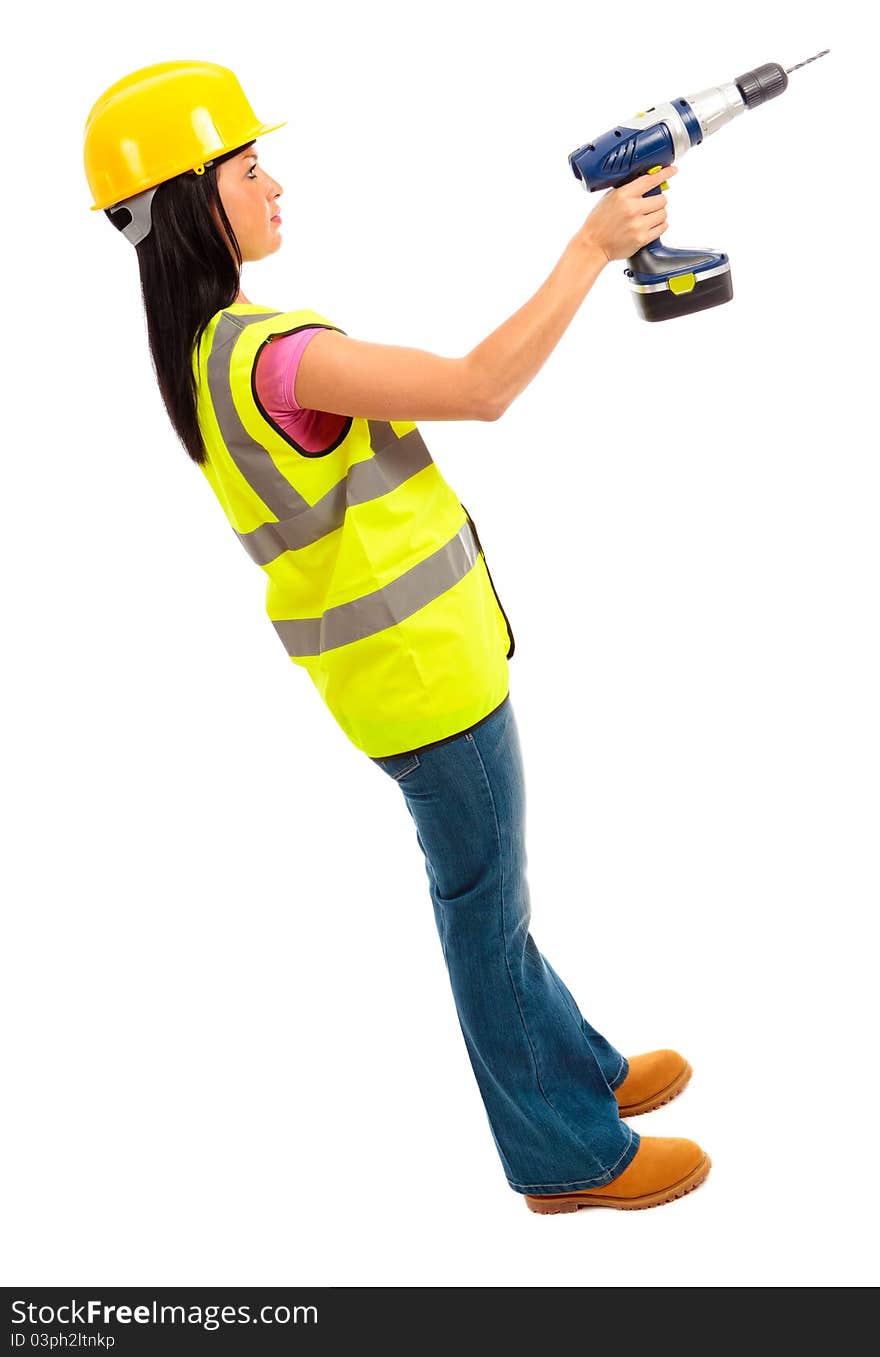 A females dressed in a high visibility jacket holding a cordless drill on isloated white background. A females dressed in a high visibility jacket holding a cordless drill on isloated white background