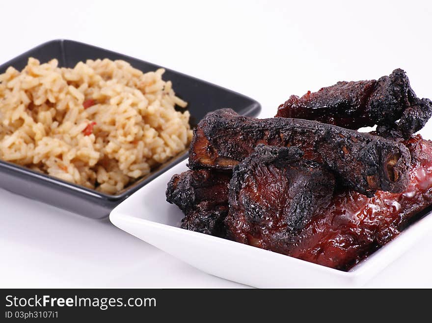 Barbecued chinese pork ribs and rice isolated on white background. Barbecued chinese pork ribs and rice isolated on white background