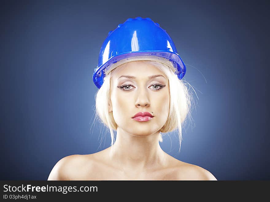 Beautiful blonde with construction helmet