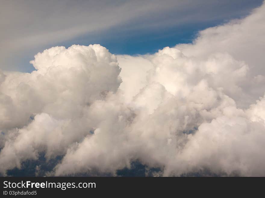 Close Shiny Clouds On Blue Sky