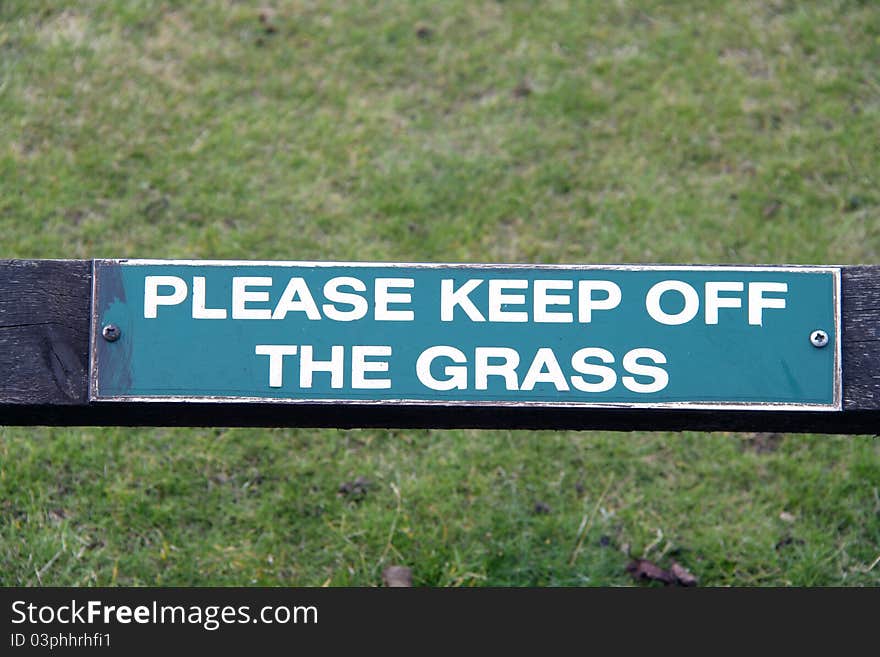 Please Keep off the grass sign closeup