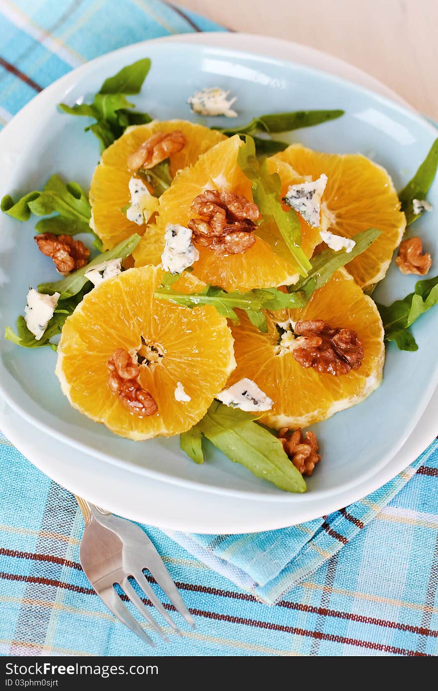 Fresh salad with oranges, walnuts and cheese