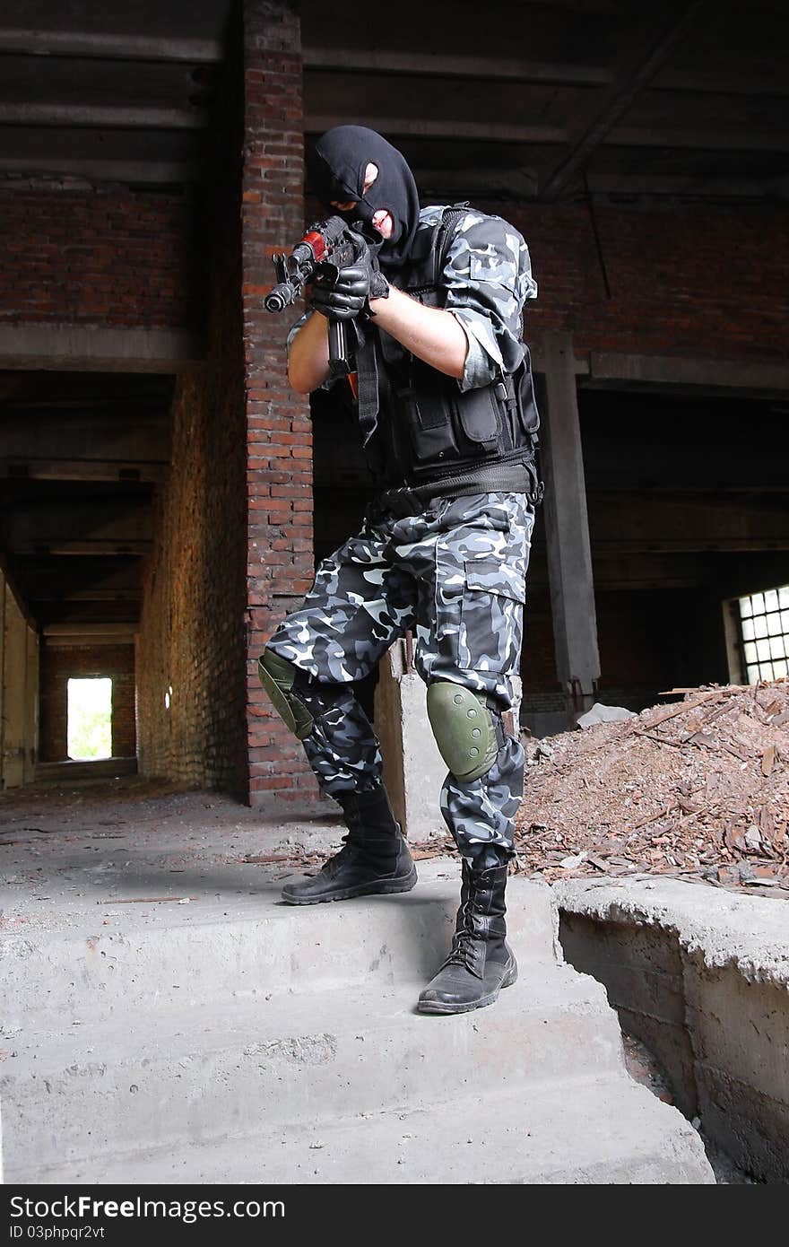 Armed Terrorist In Black Mask Targeting With A Gun