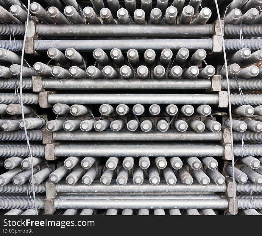 Pile of metal machine bolts in many layers. Pile of metal machine bolts in many layers