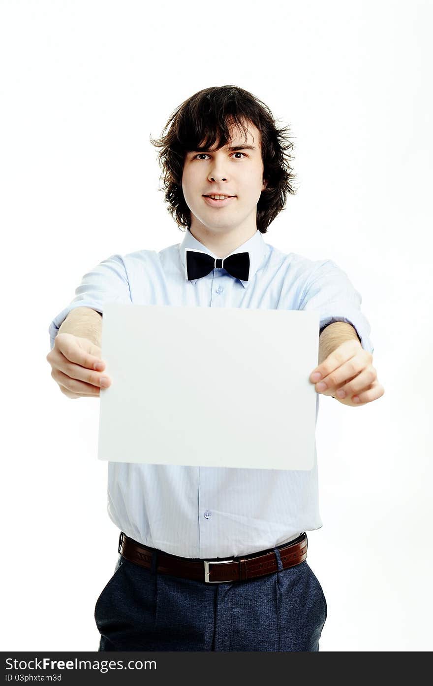 A young handsome man showing a sheet of paper. A young handsome man showing a sheet of paper