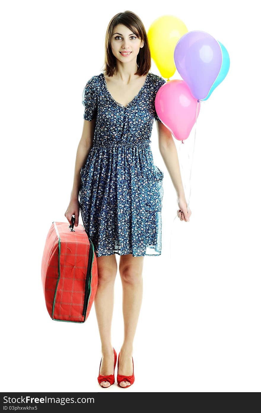 A young beautiful woman with balloons and a bag. A young beautiful woman with balloons and a bag