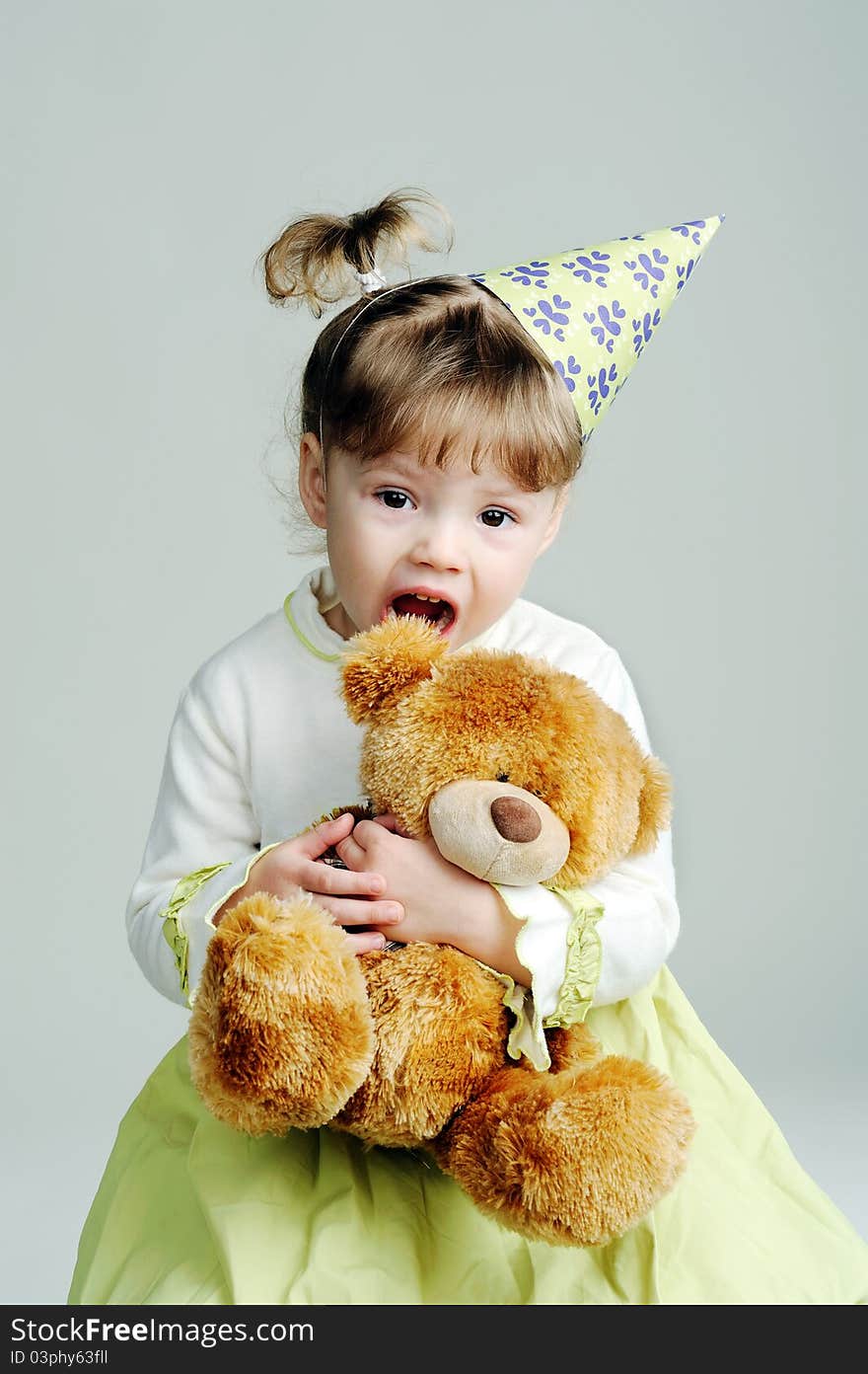 An image of a portrait of a little girl with teddy-bear. An image of a portrait of a little girl with teddy-bear